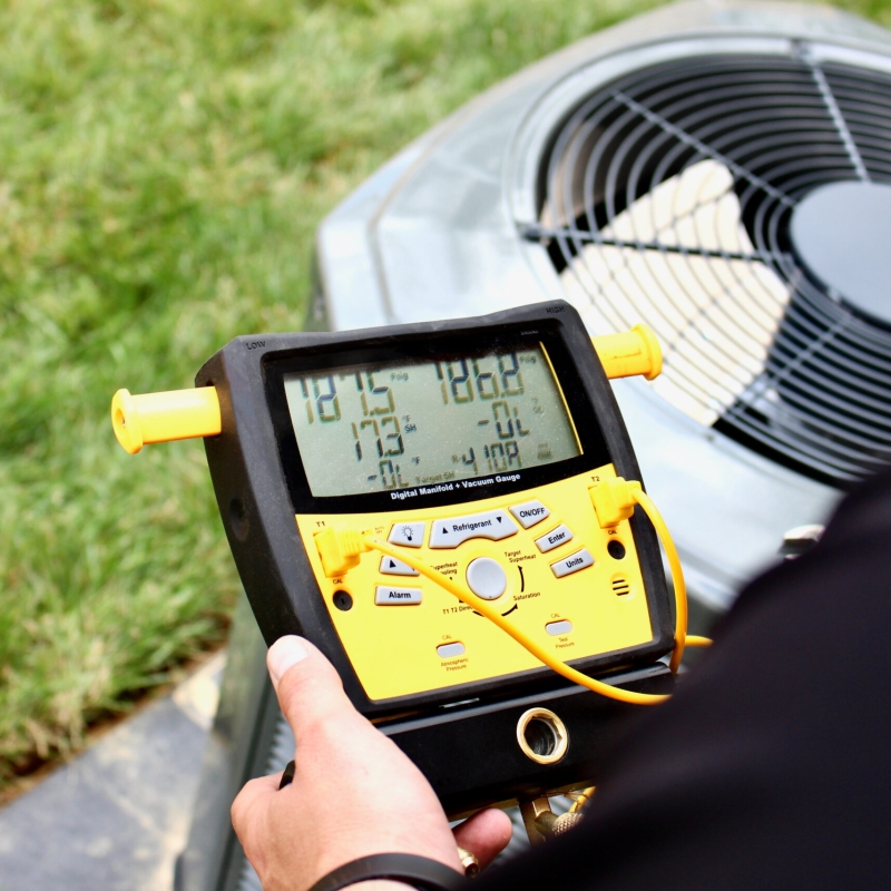 Air Conditioner repair man installing HVAC system